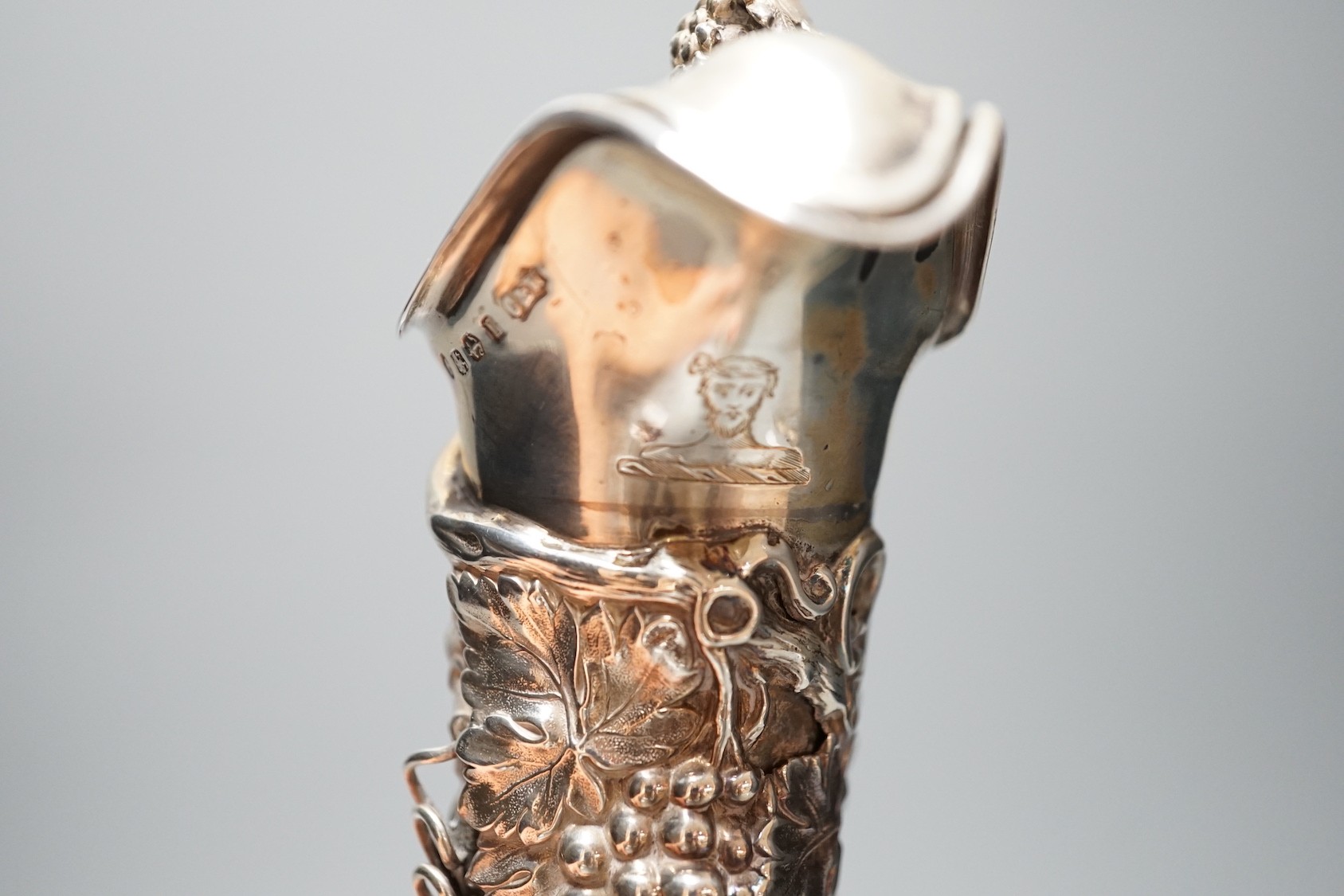 A Victorian silver mounted cut glass claret jug, with fruiting vine decoration, Cartwright & Woodward, Birmingham, 1860, 32cm.